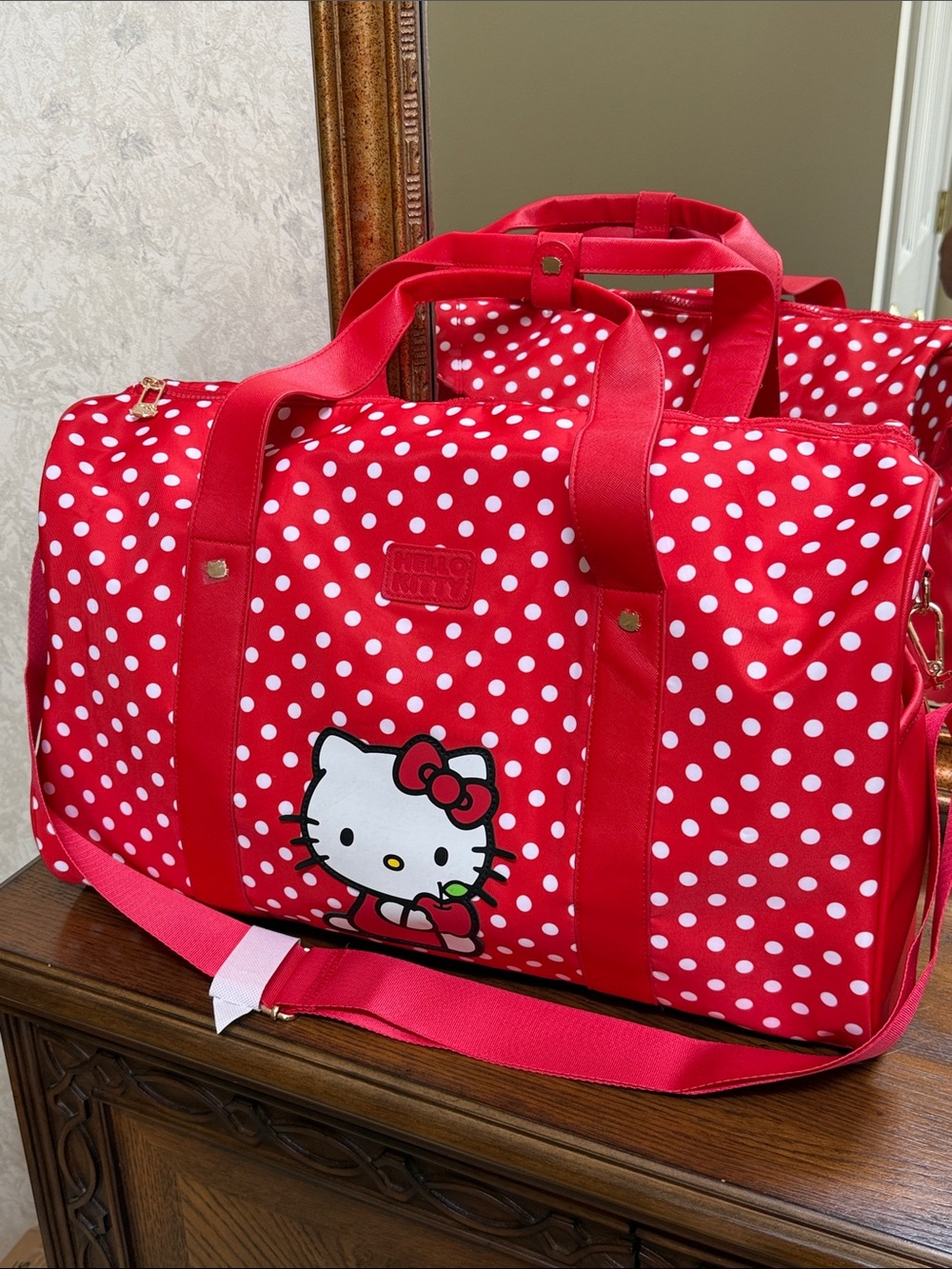 New w/o tag. Hello Kitty Red & White Polka Dot Travel Duffel.
